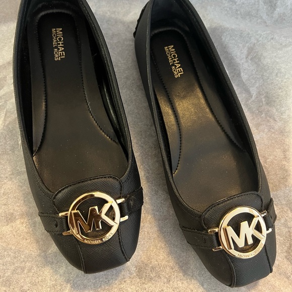 Michael Kors Shoes - NWOT Michael Kors Black Moccasin with Gold Accent 7.5M
